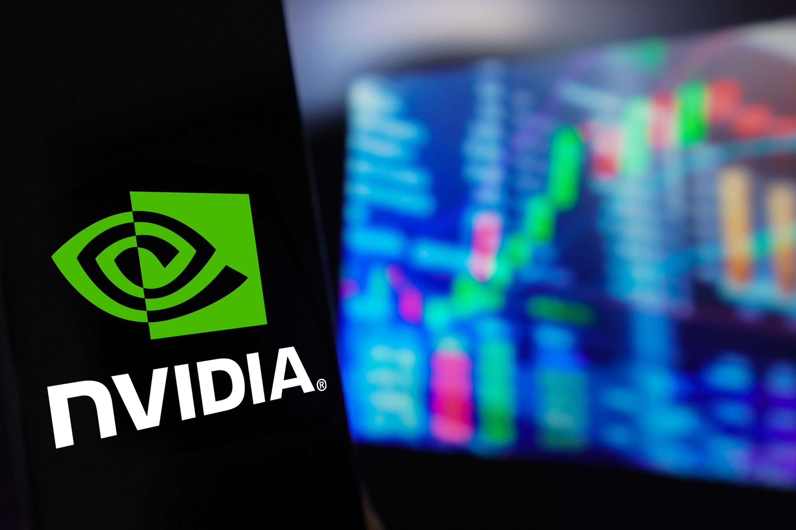 March 22 2024 Brazil In this photo illustration the Nvidia Corporation logo is displayed on a smartphone screen with a graphic representation of the stock market in the background