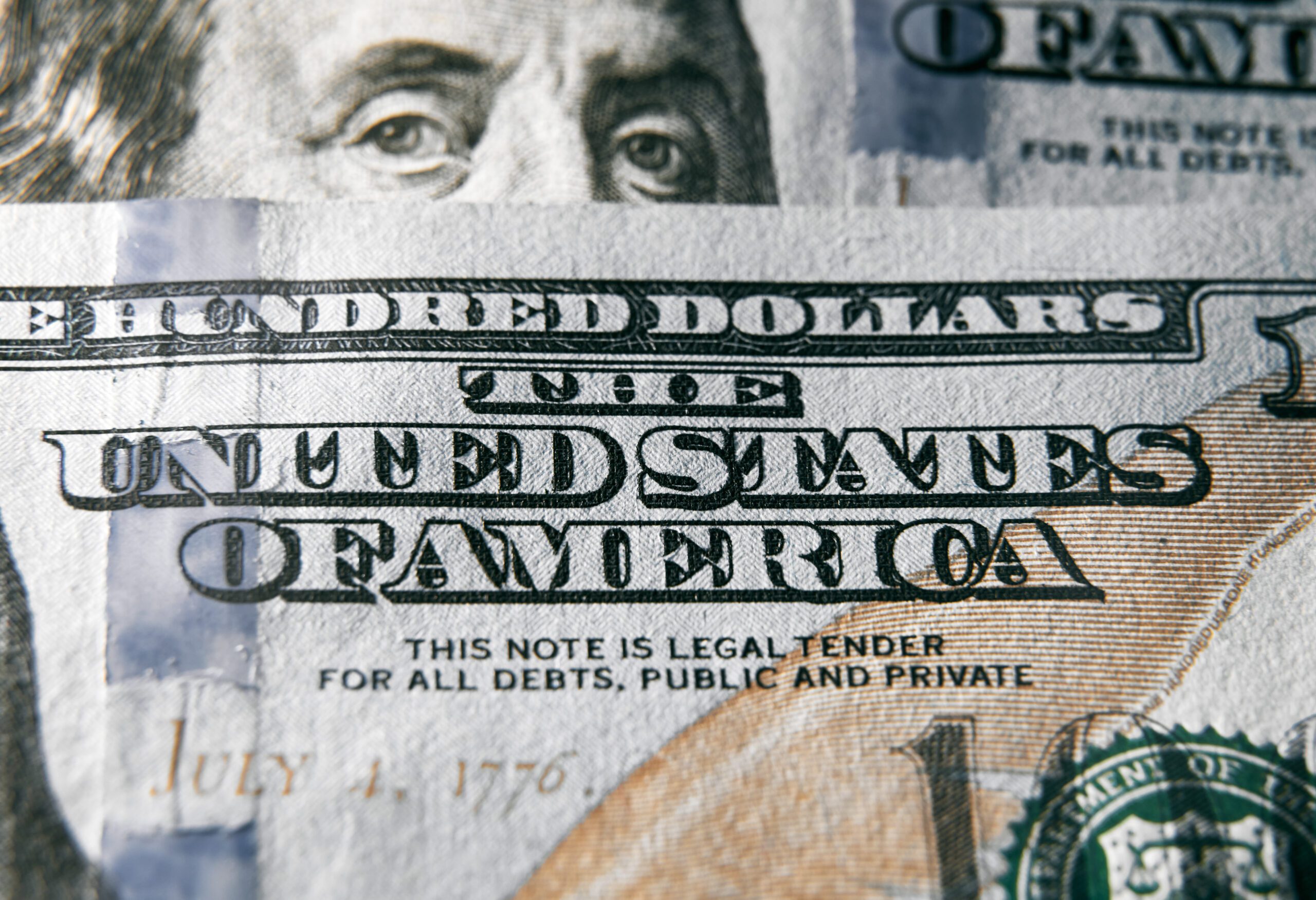 The United States of America sign on the one hundred dollar bill Close up shot with sharp texture Macro shot of US Dollar money